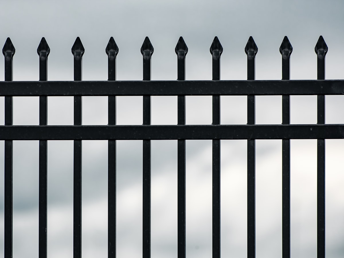 Simple black aluminum fence with straight pickets