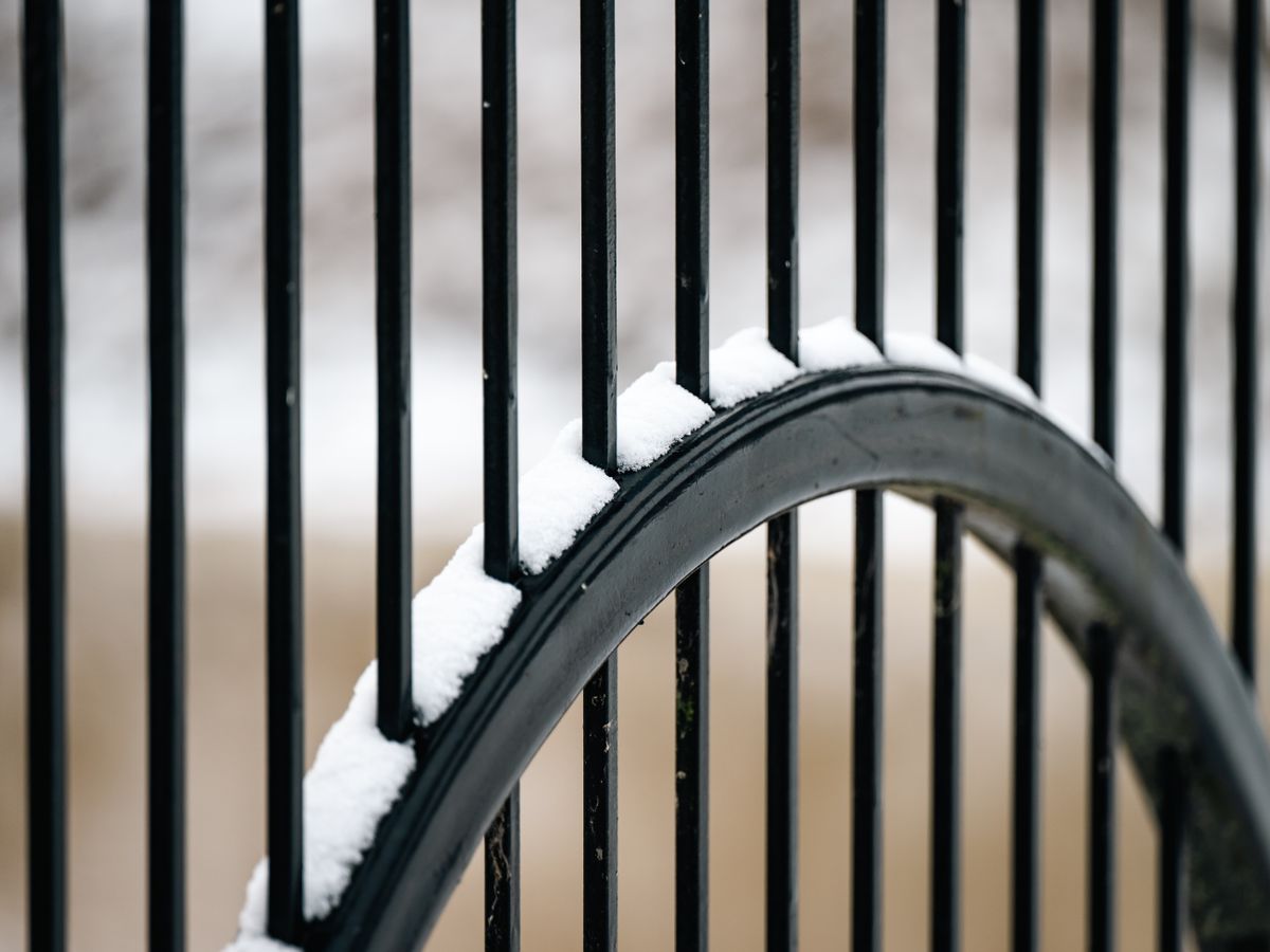 Plain black aluminum fence with vertical bars